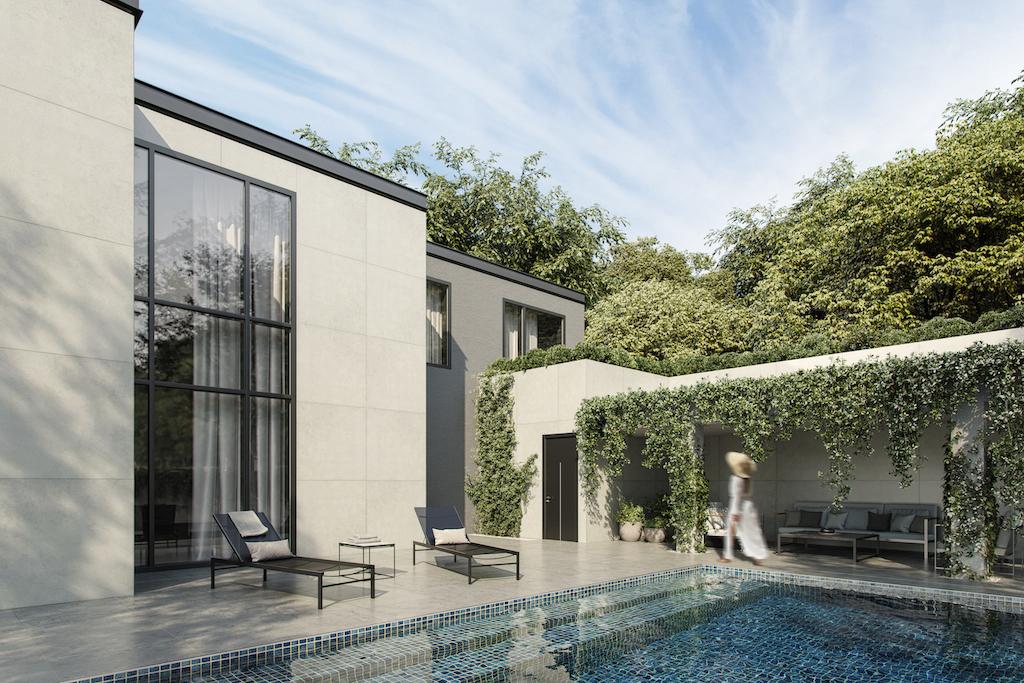 A backyard of a white contemporary home. There is a pool in the backyard and greenery climbing up the walls of the home. 